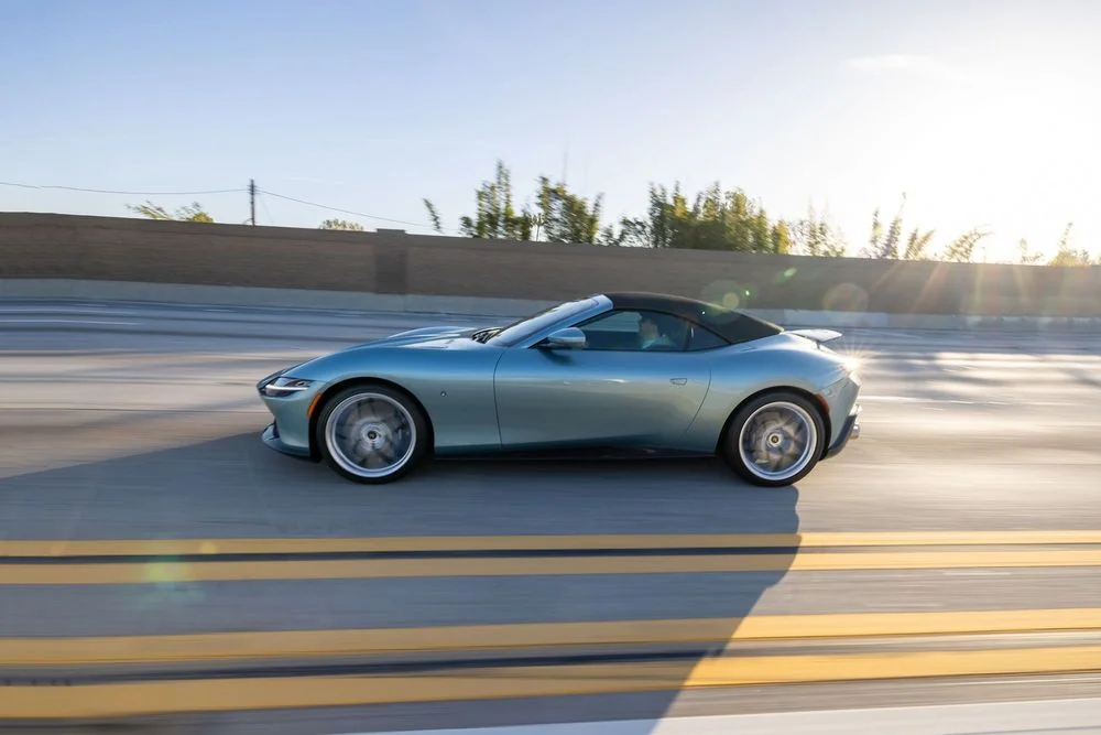 Ferrari Roma Spider driving on an open California road