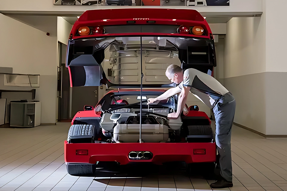 Ferrari technician servicing a Ferrari F40